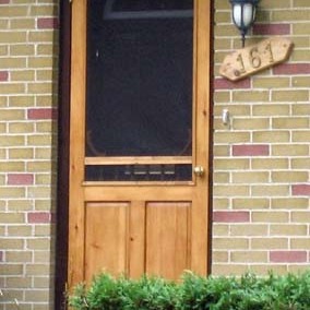  A stained #1 common Pine "Reg" screen door on Avon Street, Stratford.