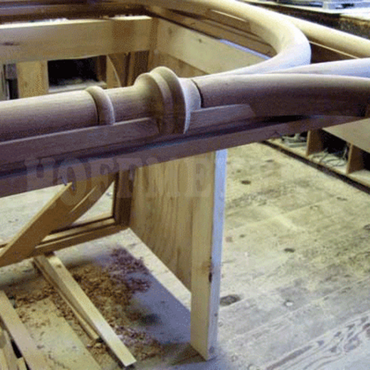 A detailed view of the unpainted curved mouldings